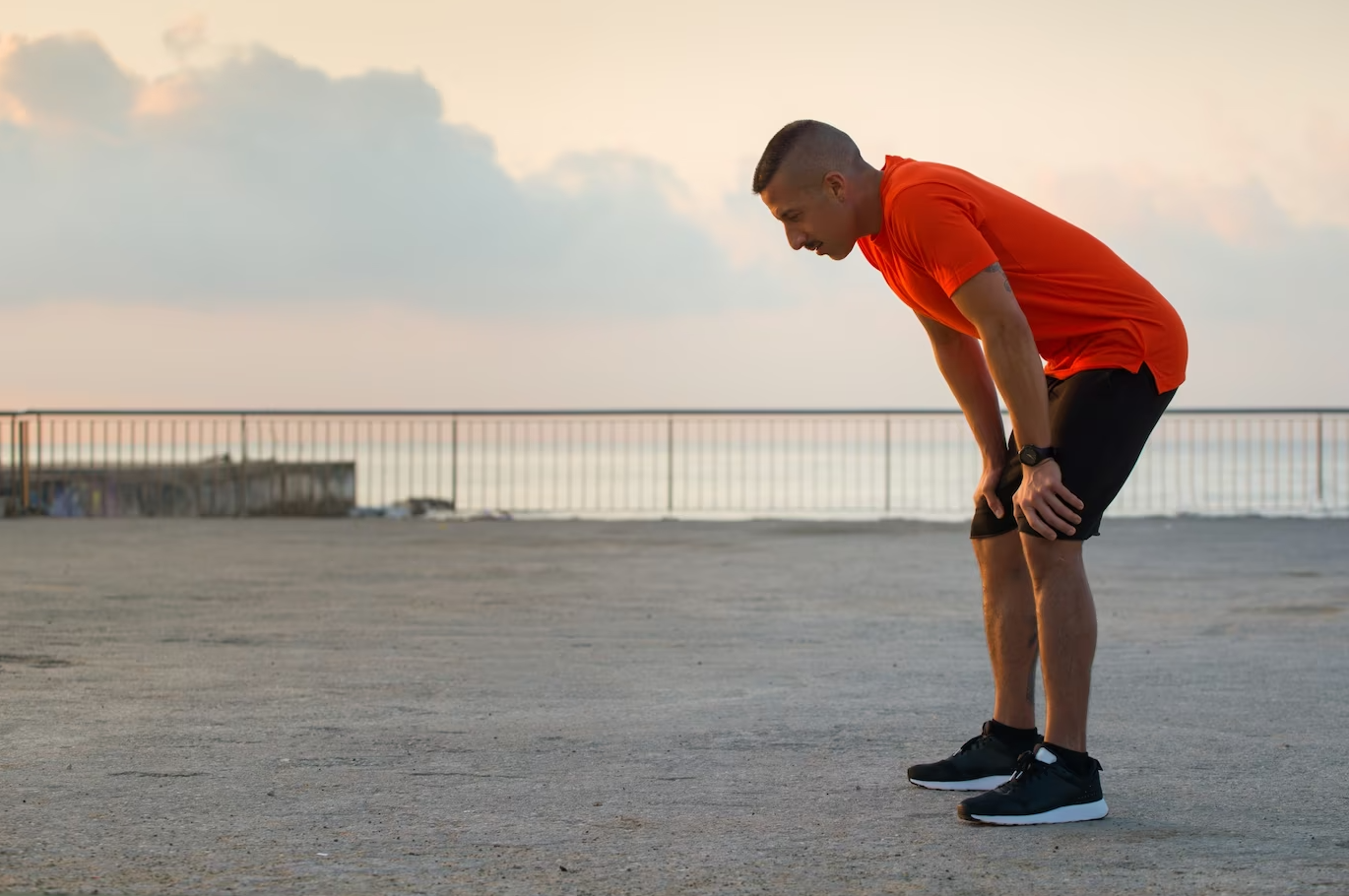 An athlete struggling to keep up with a race due to hypertension