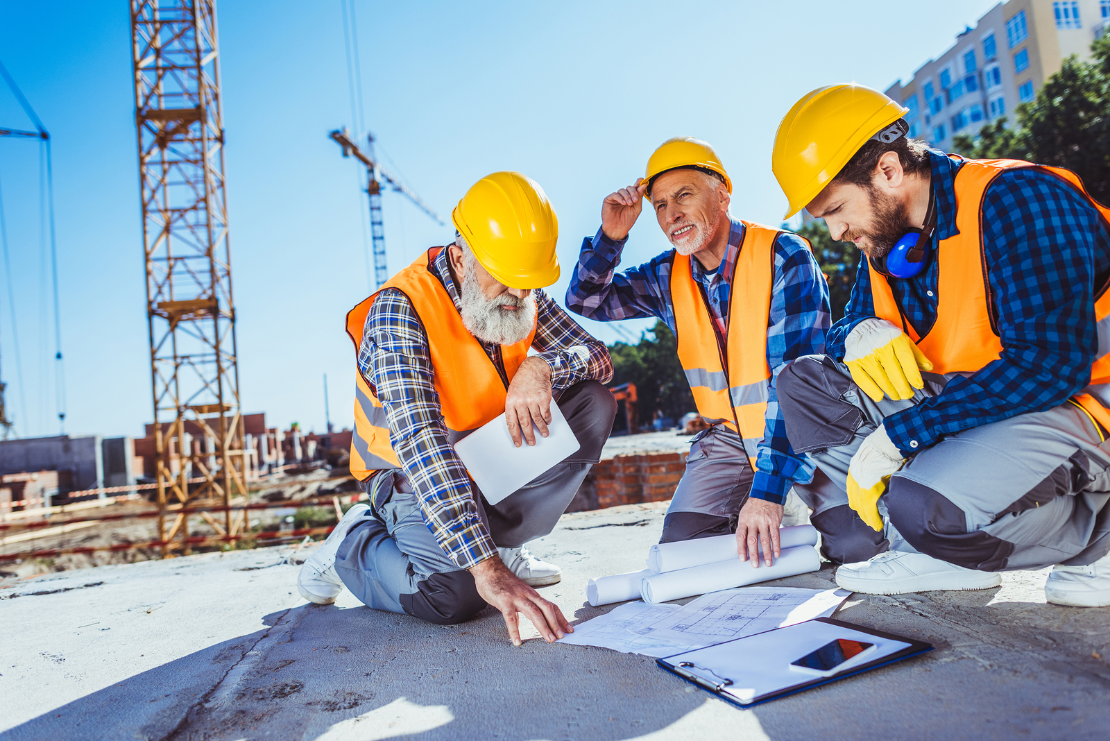 Construction workers wearing hard hats on a job site