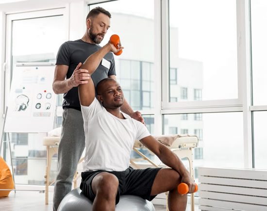 man rehabbing shoulder man rehabbing shoulder