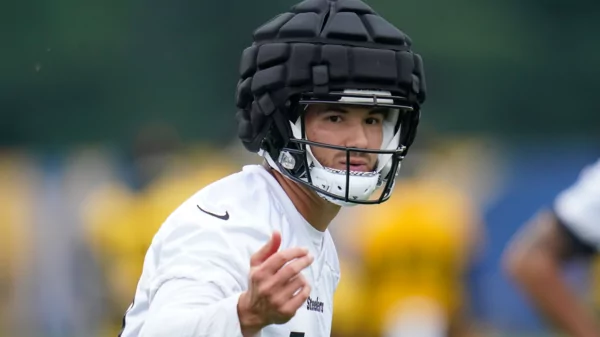 Triathlon Injury Treatment and Support in Austin 36 football player wearing headgear to get protection from concussion