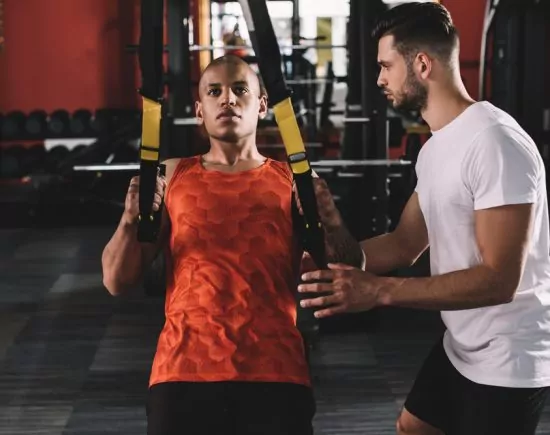 Man Training with Trainer Man Training with Trainer